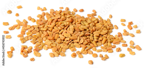raw fenugreek seeds isolated on white photo