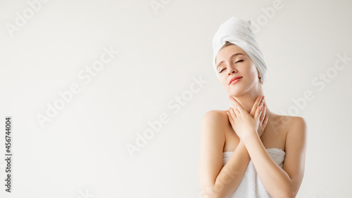 Spa procedure. Inspired woman. Skincare treatment. Advertising background. Pretty lady covering in towel enjoying smooth skin isolated white copy space.