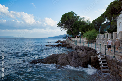 Obraz na płótnie Rijeka, Croatia - August 11, 2021: Resort on the Adriatic Sea. City beaches, vegetation and buildings in Croatia. Seascape with a stone shore. w salonie
