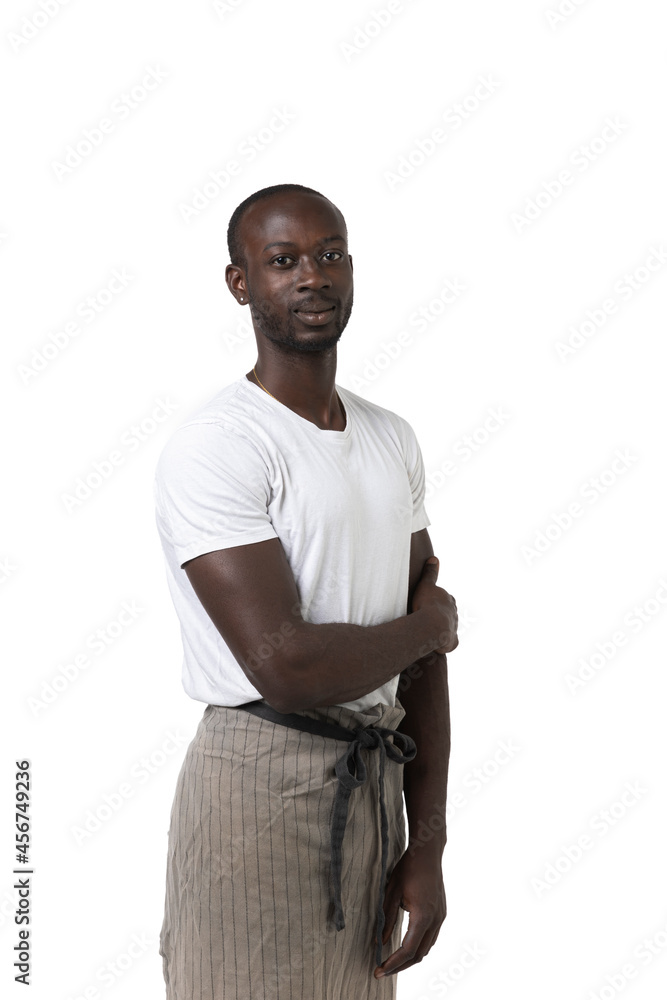 African boy with apron poses three-quarter on white background in photo studio African boy with apron poses three-quarter on white background in photo studio