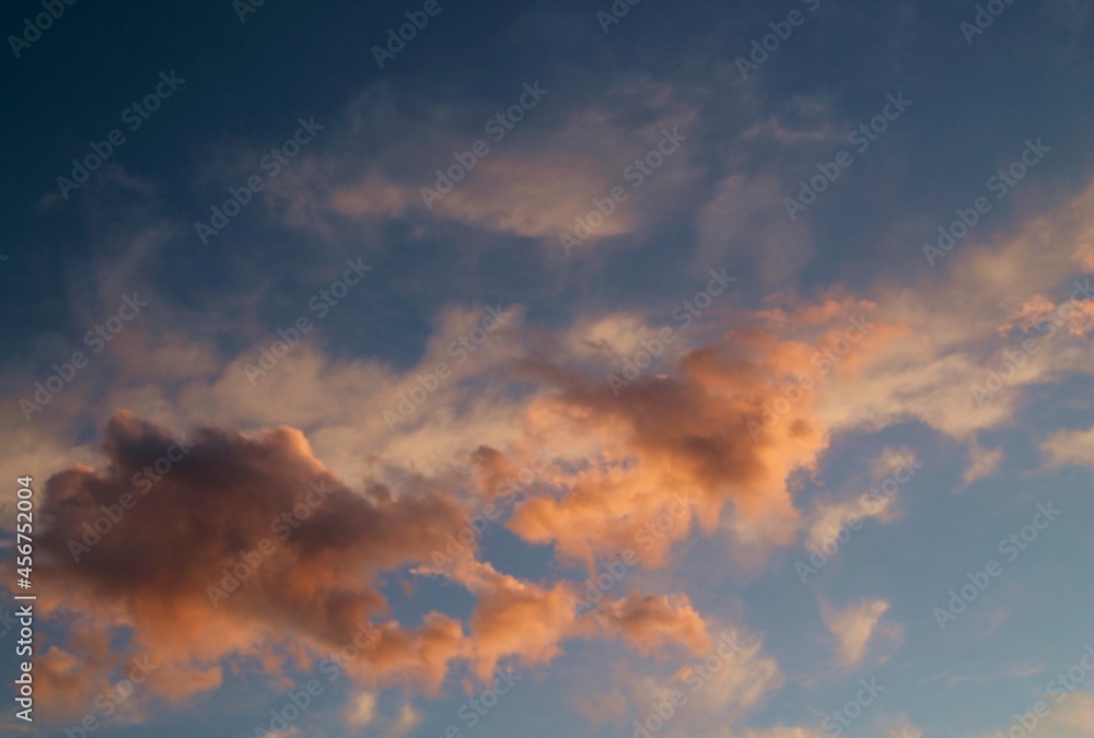 Pink clouds. Pink clouds on a background of blue sky at sunset. Background image.