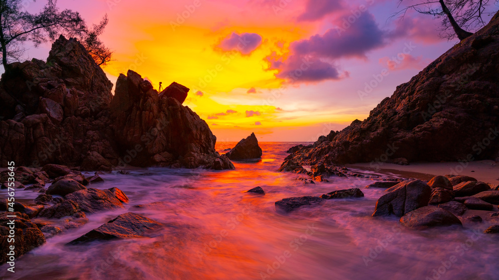 Long exposure image of Dramatic sky seascape with rock in sunset scenery background Amazing light nature landscape