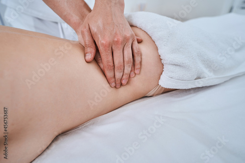 Woman receiving a massage for lumbar myalgia