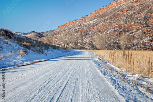 winter driving in Colorado, backcountry road covered by snow