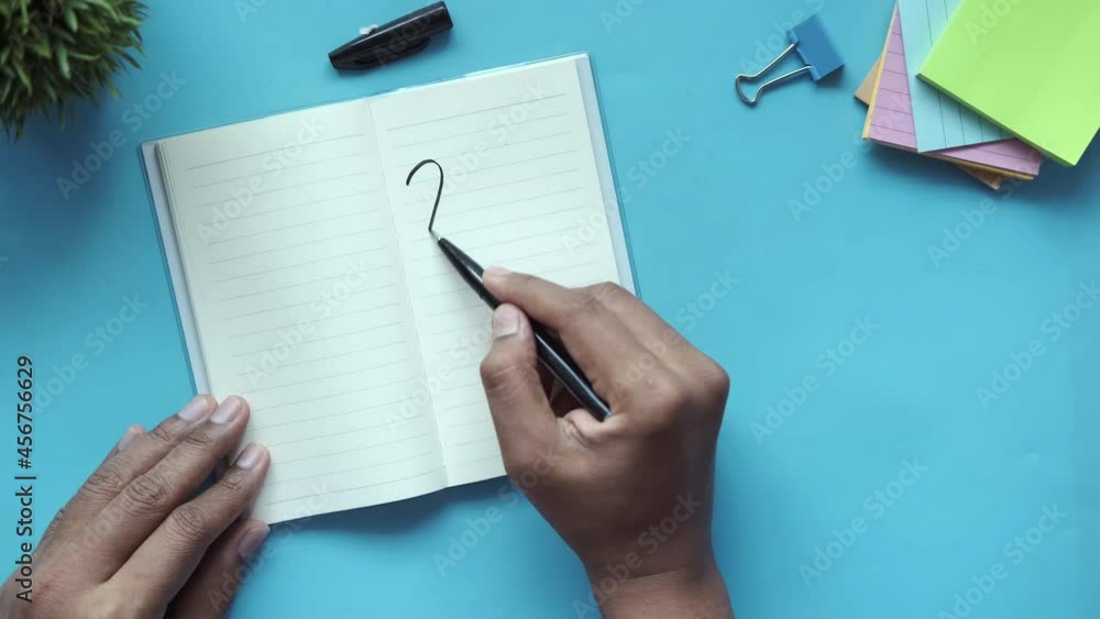 writing 2022 new year on notepad and stationary on table writing 2022 new year on notepad and stationary on table