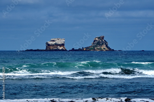 Rocky islets off the beach in Ayampe, Ecuador photo