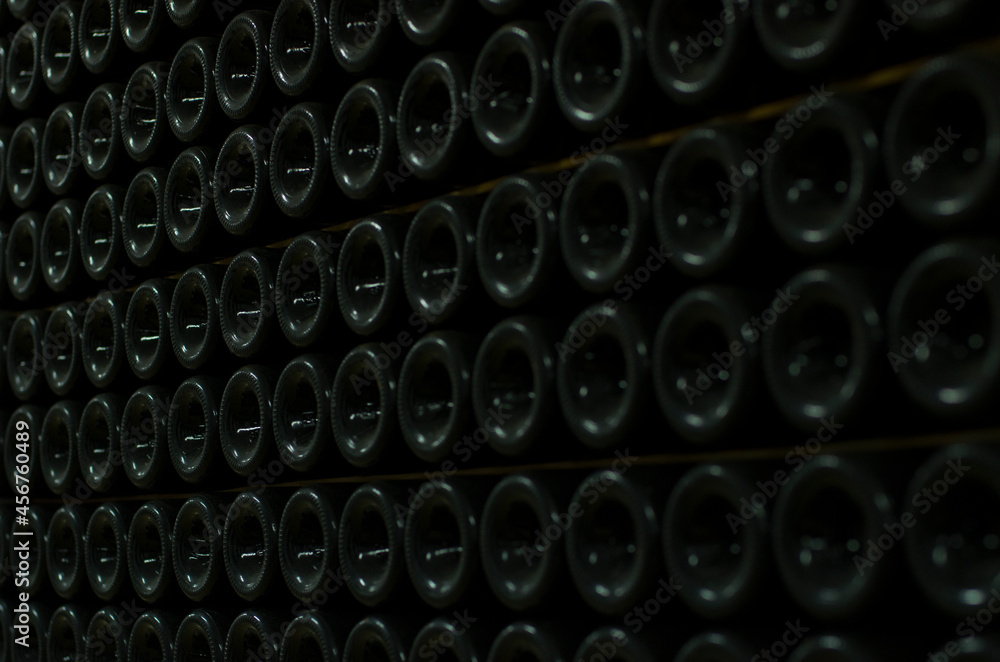 Bottles in the wine cellar. Collector's wine. Winemaking. The best wine in the world. Aged wine. Dust on the bottles. Bottles in the wine cellar. Collector's wine. Winemaking. The best wine in the world. Aged wine. Dust on the bottles.