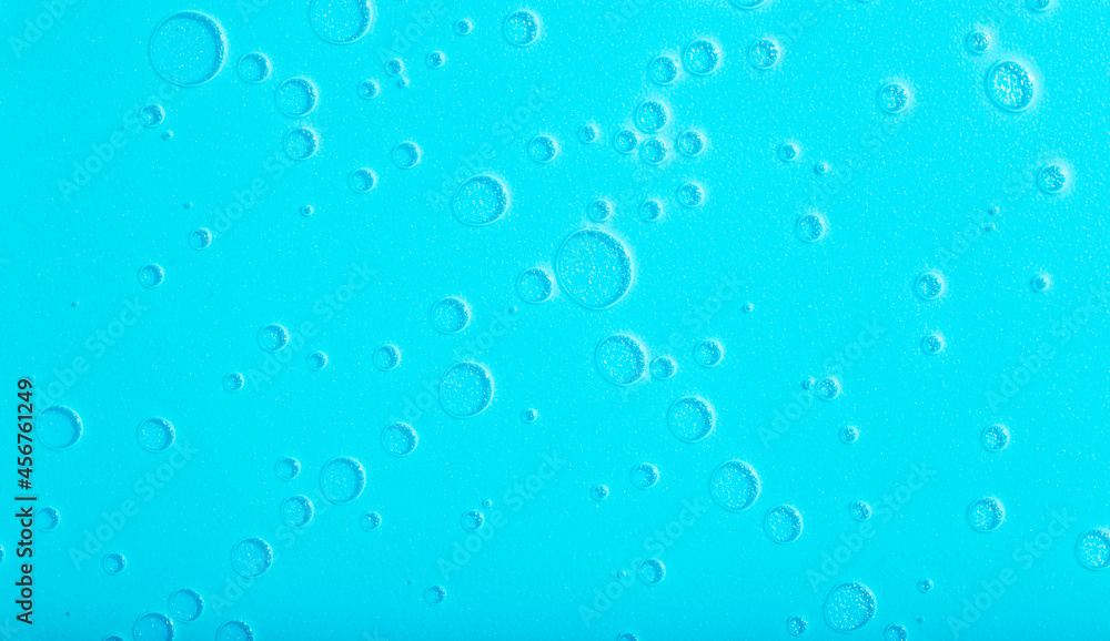 Blue liquid abstract background. Bubbles and textures of water on a blue background 