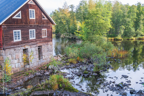 Mill by a river in the forest
