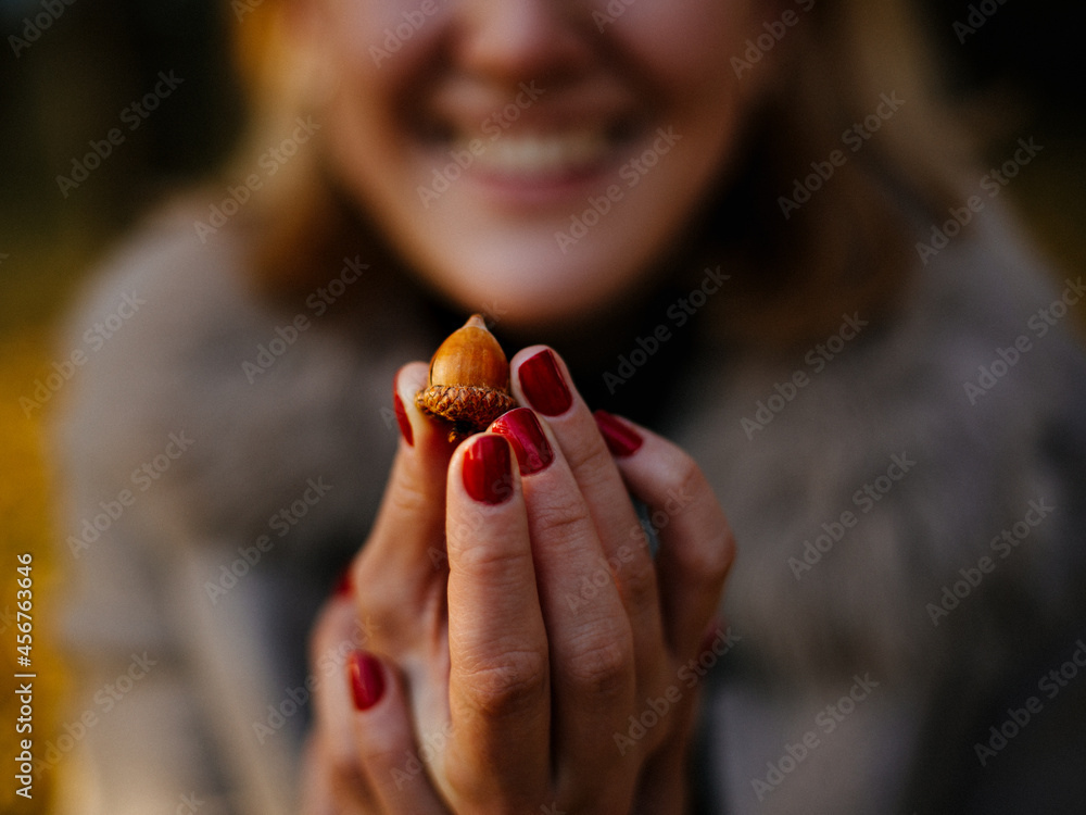 person holding a acorn nut person holding a acorn nut