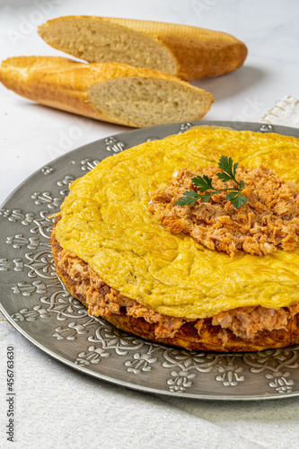 Typical Spanish tortilla with tuna in marble table