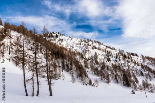 Snowy mountain scenery in the European Alps on a partly cloudy winter day