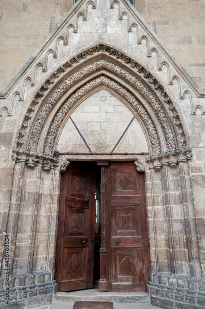 View of the door of an old roman catholic church