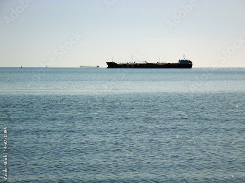 Silhouette of a ship at sea.