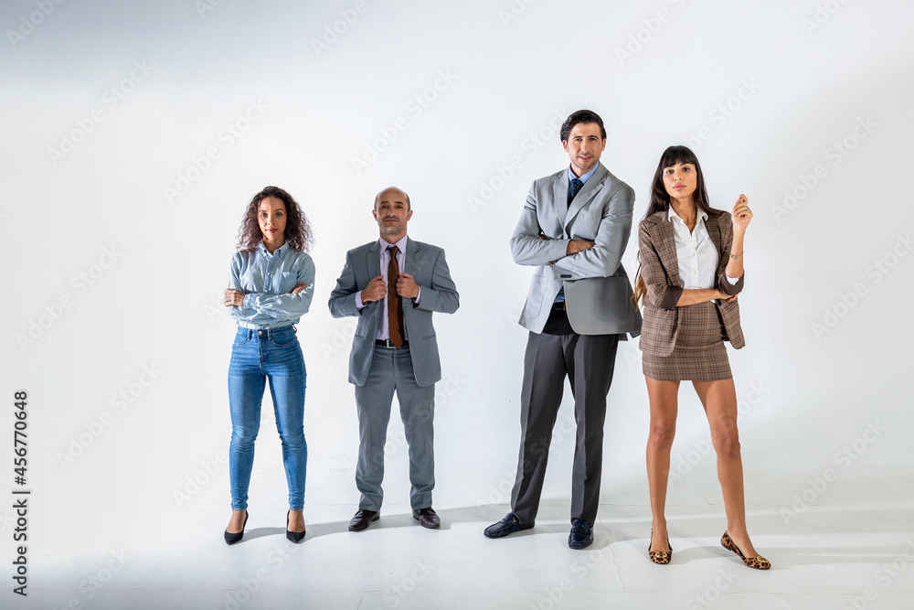 Obraz premium The businesspeople standing on the white wall background group of successful business people isolated on white.