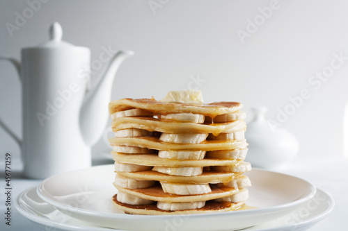 Pancakes with banana and syrup