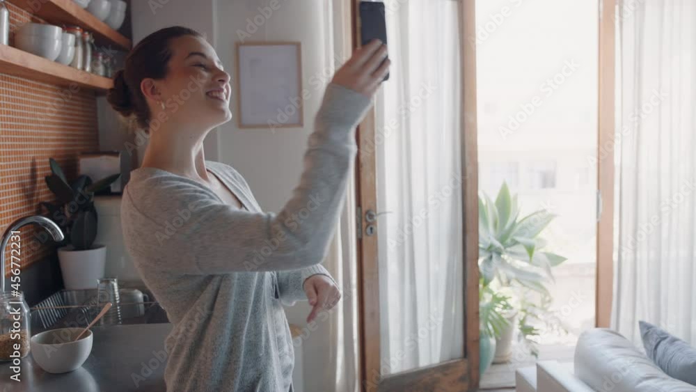happy woman having video chat using smartphone at home chatting to friend showing apartment enjoying conversation sharing lifestyle on mobile phone happy woman having video chat using smartphone at home chatting to friend showing apartment enjoying conversation sharing lifestyle on mobile phone