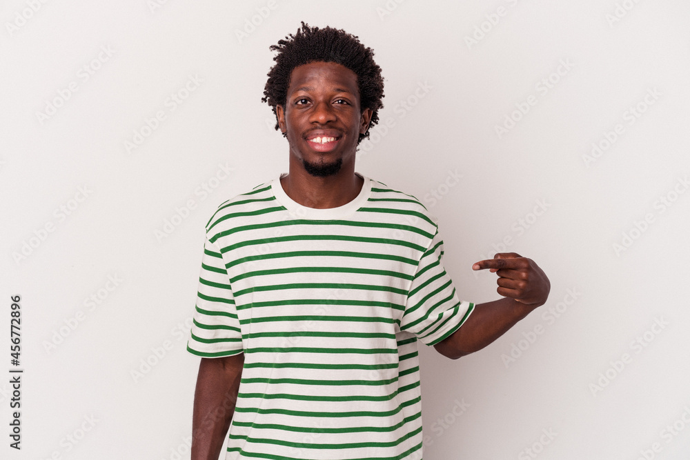 Young african american man isolated on white background person pointing by hand to a shirt copy space, proud and confident Young african american man isolated on white background person pointing by hand to a shirt copy space, proud and confident