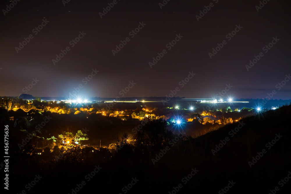 Night shooting of the settlement from the mountain.
