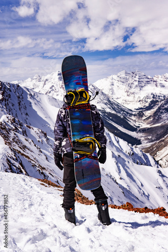 Extreme Snowboarder Standing On Epic Snow Mountain Summit Peak