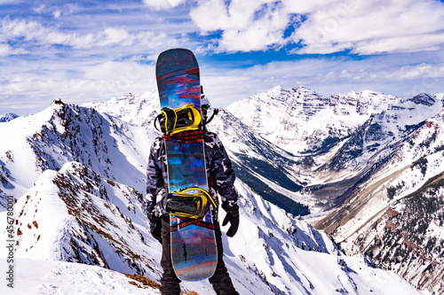 Vászonkép Snowboarder On Epic Mountain Summit Peak In Snow
