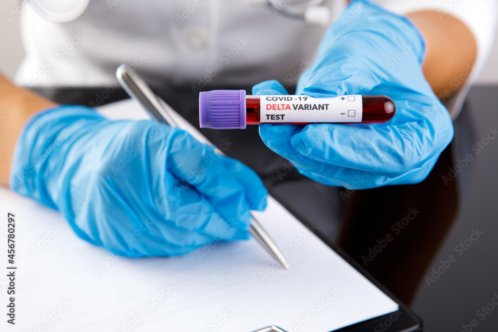 covid 19 delta Variant vaccine and test blood in hand on white background. vaccination against coronavirus covid 19 delta Variant vaccine and test blood in hand on white background. vaccination against coronavirus