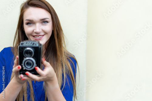 Creative girl taking a picture with vintage camera © Vittorio Gravino