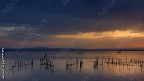 Albufera  Valencia lagoon in Spain. Close to sunset time with an impressive cloudy sky and beautiful colors.