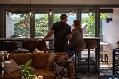 Backview of couple relaxing at home