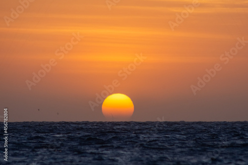 Fototapeta Naklejka Na Ścianę i Meble -  Sunset com kitsurf no mar. Pôr do sol na praia de Barra Grande, litoral do Piauí, nordeste brasileiro.