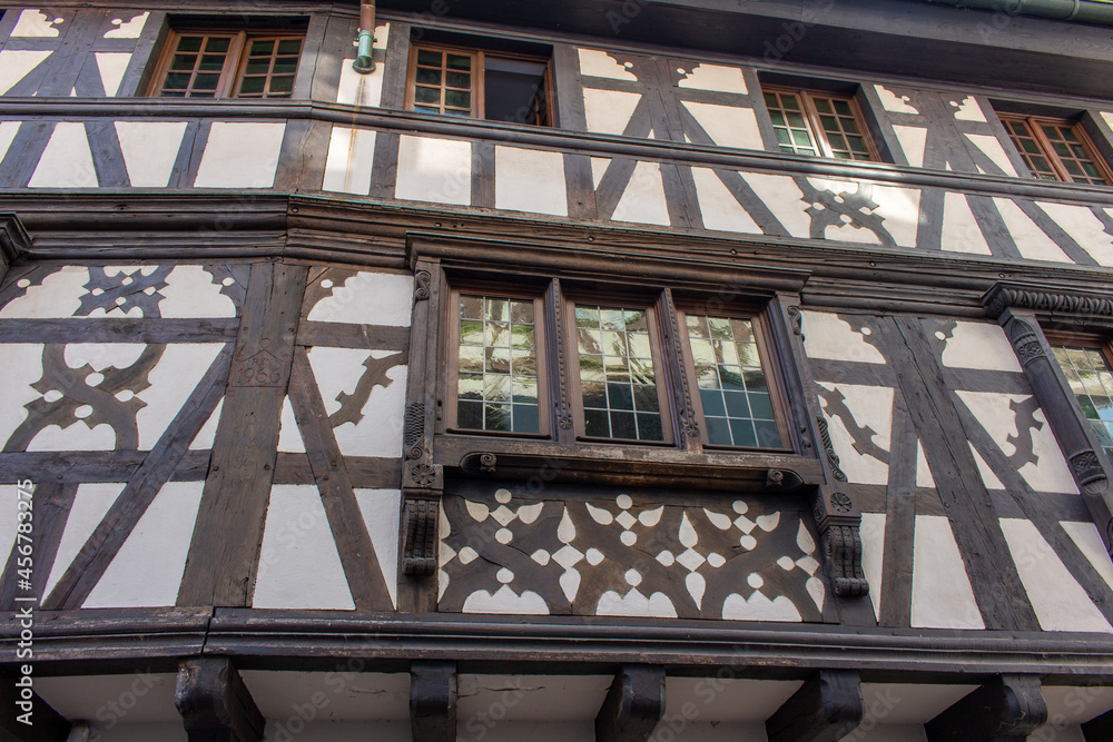 Exterior view of traditional German inspired half-timber framed building architecture in Strasbourg, France
