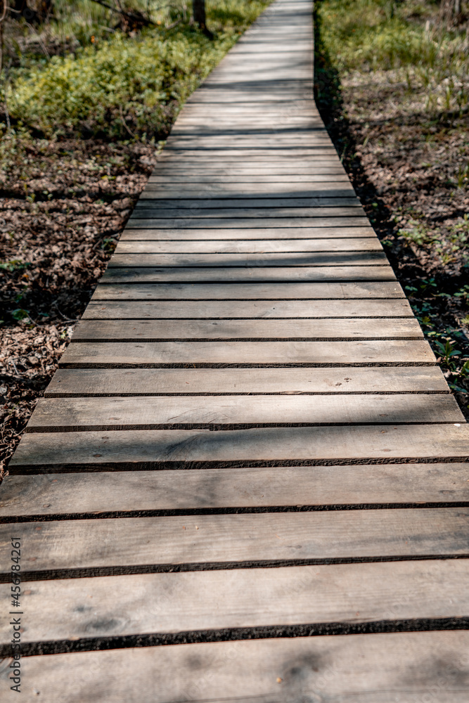 Wooden walkway. The floors are wooden. Wooden planks fastened together (1006)