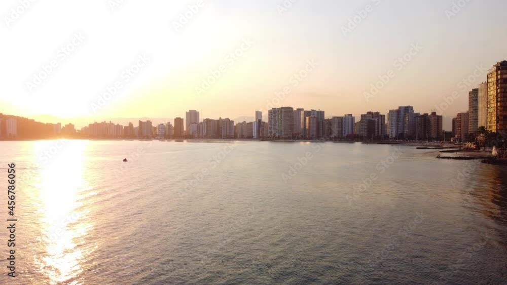Aerial view across Itarare Beach in Sao Vicente near Sao Paulo Brazil. Sun is setting at golden hour. Aerial view across Itarare Beach in Sao Vicente near Sao Paulo Brazil. Sun is setting at golden hour.