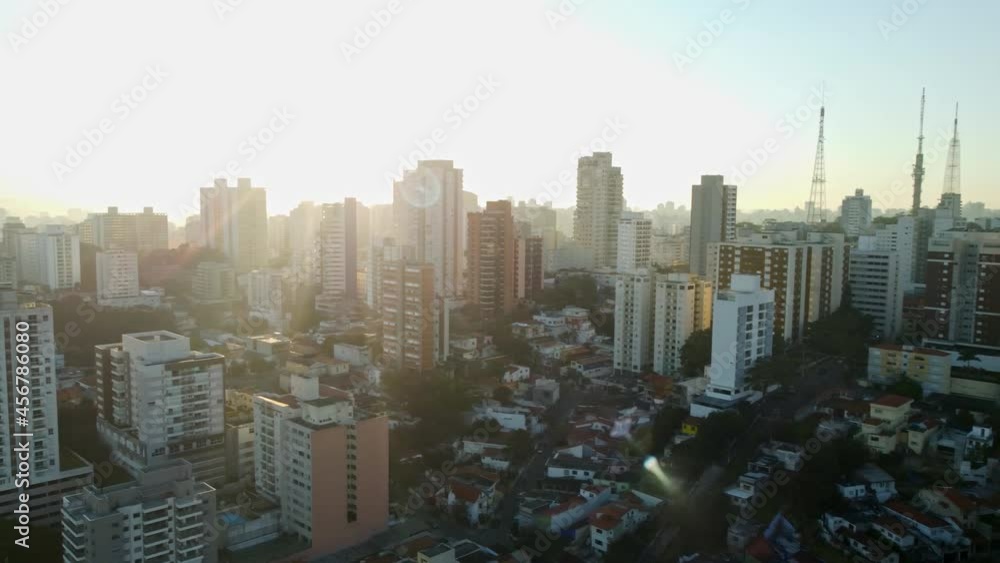 Aerial view over the city of Sao Paulo Brazil. It is dawn and the early sun causes lens flares. Aerial view over the city of Sao Paulo Brazil. It is dawn and the early sun causes lens flares.