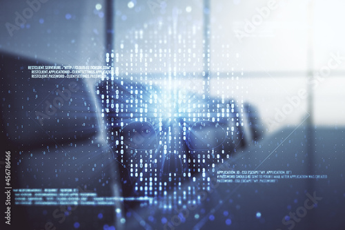 Abstract virtual code skull hologram on a modern coworking room background, cybercrime and hacking concept. Multiexposure
