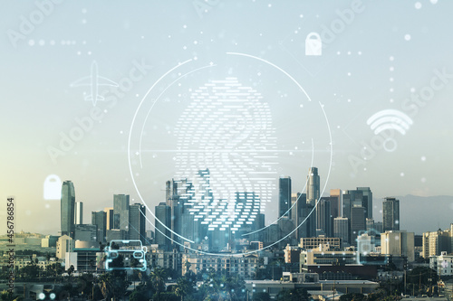 Multi exposure of virtual creative fingerprint hologram on Los Angeles skyscrapers background, personal biometric data concept
