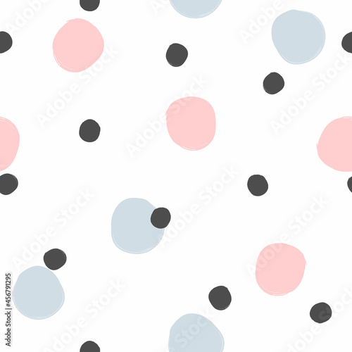 Seamless pattern with randomly scattered round spots painted with a watercolor brush. Simple print for girls. Cute vector illustration.