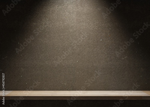 Empty shelf in a dark room on a concrete wall. Template for product demonstration. Spotlight on a top. 3D rendering.