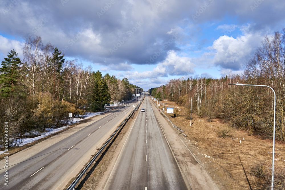 Highway in Lithuania on a sunny early spring day Highway in Lithuania on a sunny early spring day