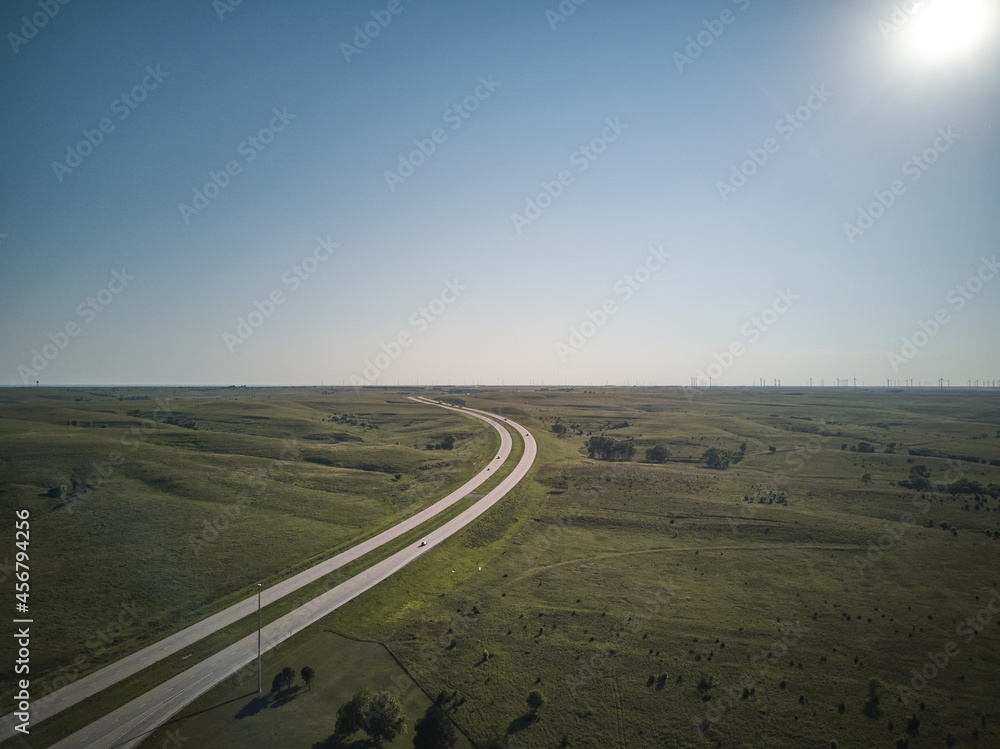 Aerial drone image of Highway 70 west and east bound through the state of Kansas in late afternoon light