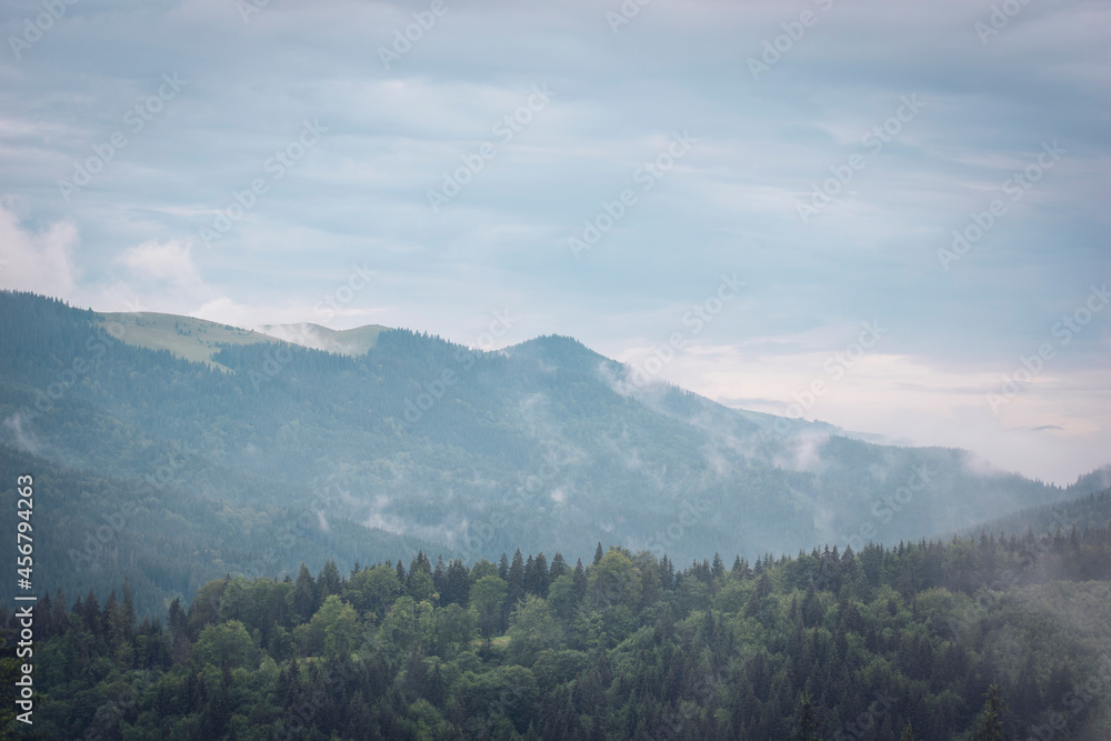 Mountains after the rain. Water evaporates from the forest