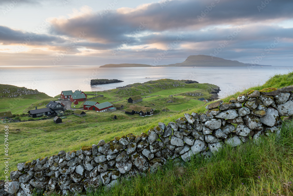 The top of the mountain of Faroe islands. A view of high peaks of mountains on a sunny day. Ocean view. 
Beautiful panoramic view. Northern Europe. Travel concept