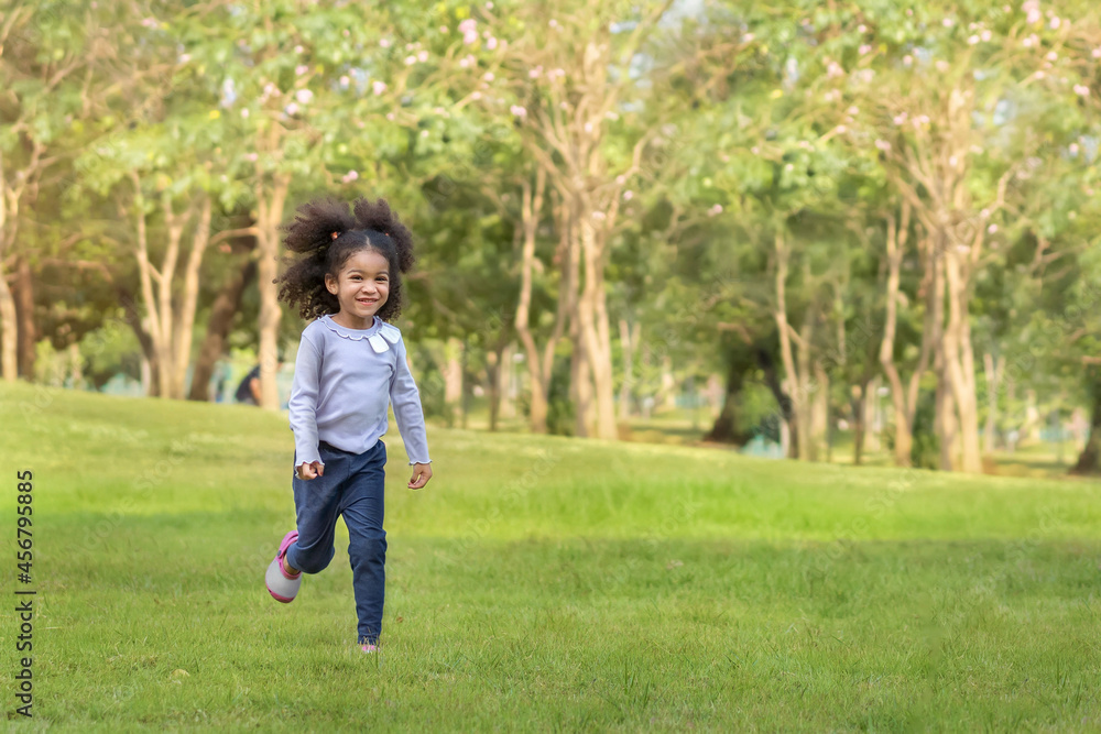 Smile cheerful african mix girl runing at outdoor park. Smile cheerful african mix girl runing at outdoor park.