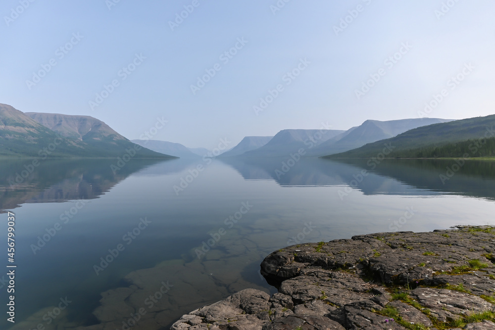 Obraz premium Putorana Plateau, a misty haze over the lake.