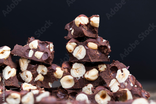 milk chocolate with whole and chunks of hazelnuts