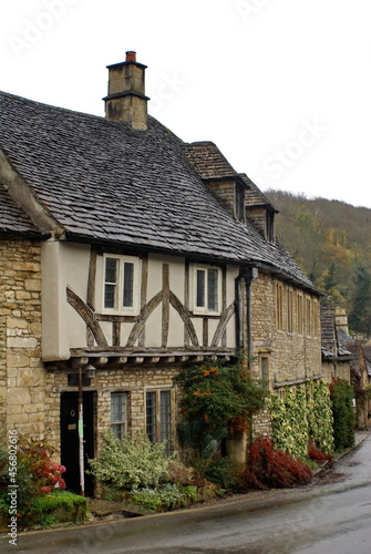 Houses in the historic section of Castle Combe, by the Bybrook River, in Wiltshire, England photo