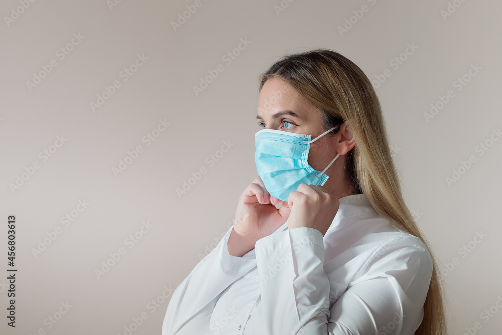 young female doctor in protective medical mask young female doctor in protective medical mask