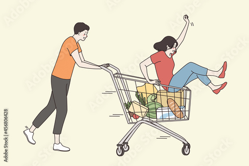 Leisure, vacation and having fun concept. Young happy couple cartoon characters fooling having fun together in supermarket trolley feeling playful excited vector illustration 