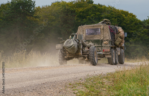 British army Steyr-Daimler-Puch BAE Systems Pinzgauer high-mobility 6x6 all-terrain vehicle tows a 105mm L118 Light Gun on military exercise Wilts UK photo