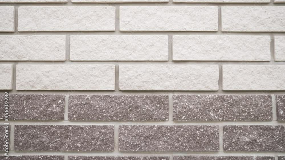 Wall in brown and white bricks. Brick wall. Texture of real wall. Wall in brown and white bricks. Brick wall. Texture of real wall.